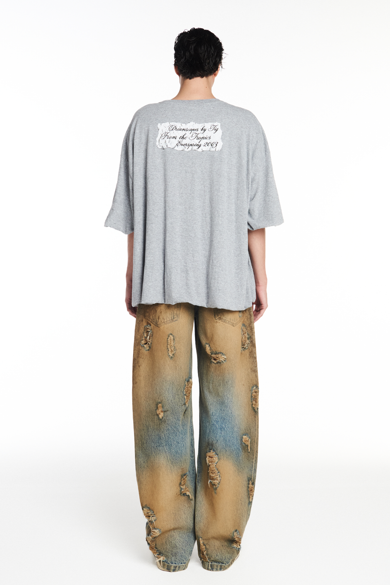 CALÇA JEANS BALLOON MANCHADA COM RASGOS (8952670748899)